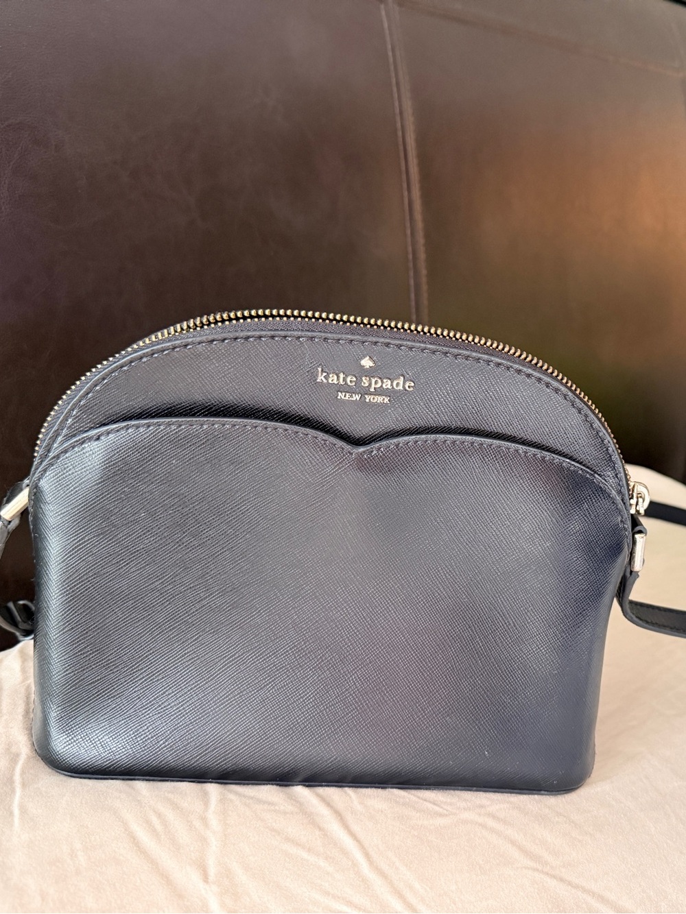 Kate Spade New York Payton Dome Crossbody in black saffiano leather.